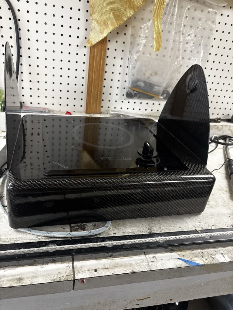 Cooktop and carbon housing assembly on the shop bench