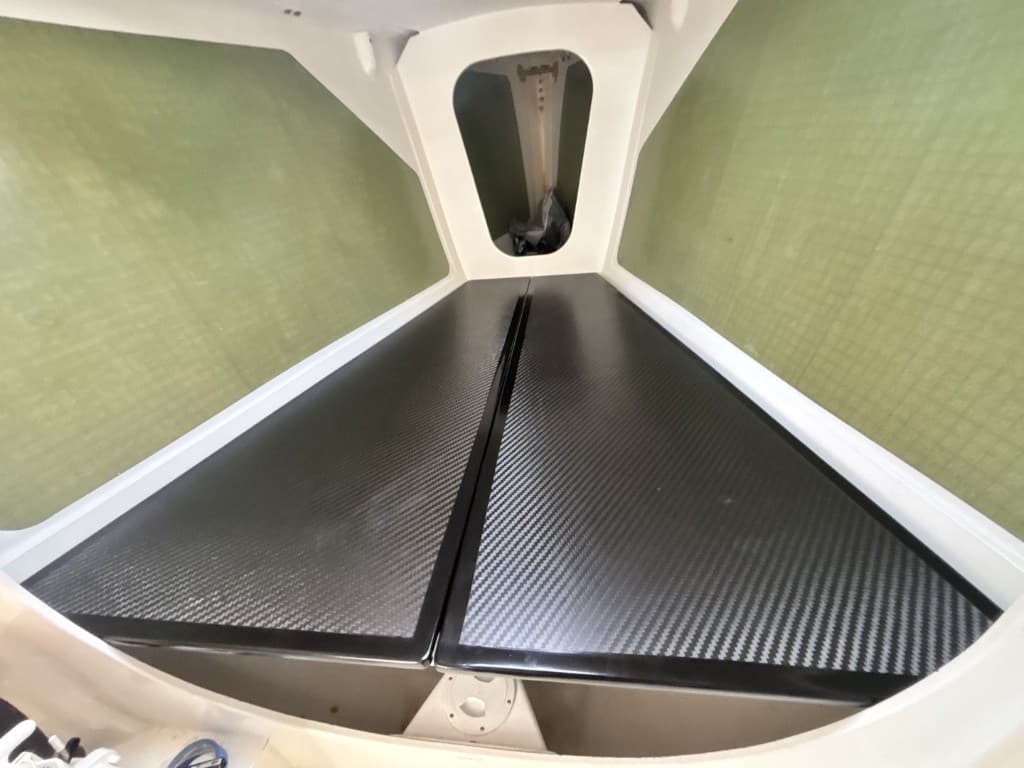 High-gloss carbon interior panels in a yacht hull